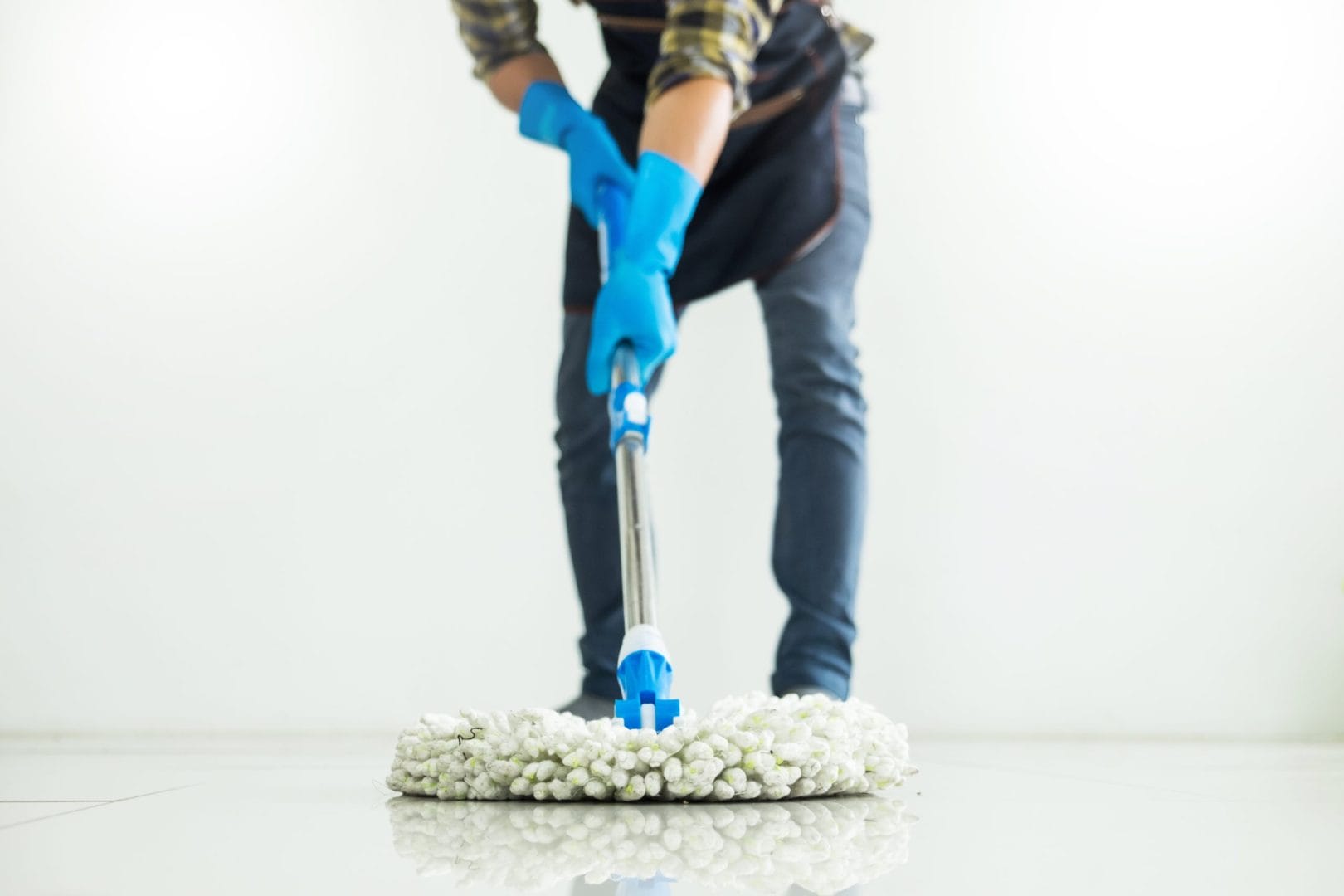 young-housekeeper-cleaning-floor-mobbing-holding-m-2025-03-08-05-50-37-utc