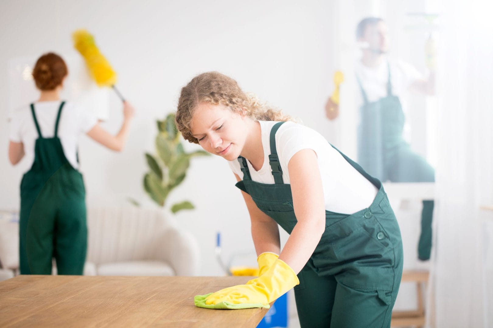 young-woman-wiping-dust-from-a-wooden-table-with-a-2025-10-11-23-39-21-utc